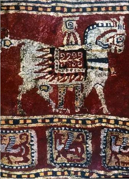 Pazyryk carpet: horseman above, griffin squares in the narrow band below