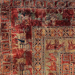 Corner of the original Pazyryk carpet: outer griffin band meeting the horsemen